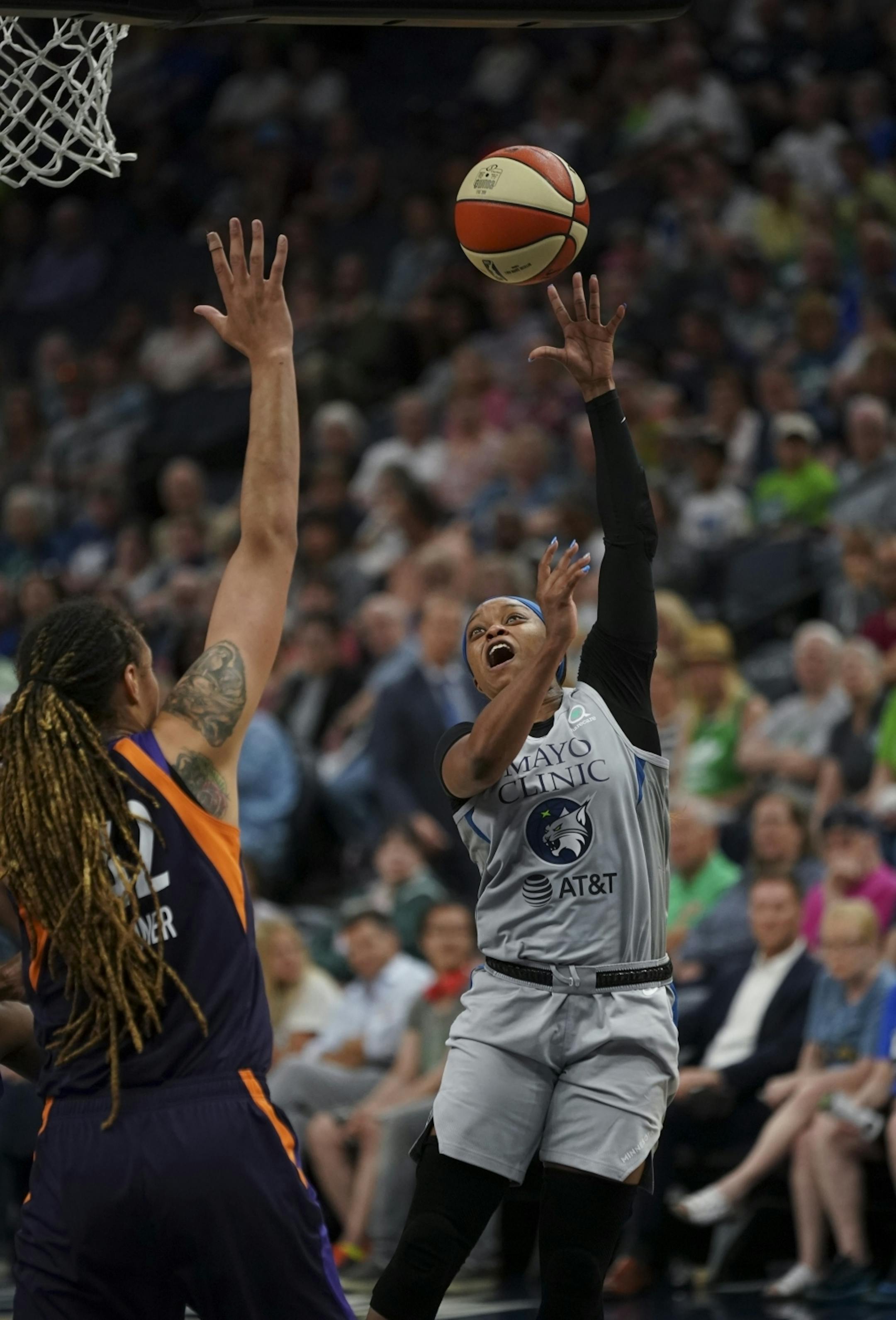 Minnesota Lynx guard Odyssey Sims tried to shoot aroun Phoenix Mercury center Brittney Griner (42) in the second quarter.