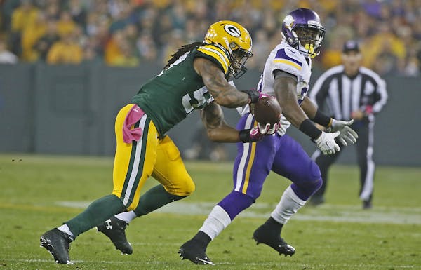 Green Bay Packers wide receiver Davante Adams (17) intercepted a ball meant for Minnesota Vikings running back Jerick McKinnon (31) in the second quar