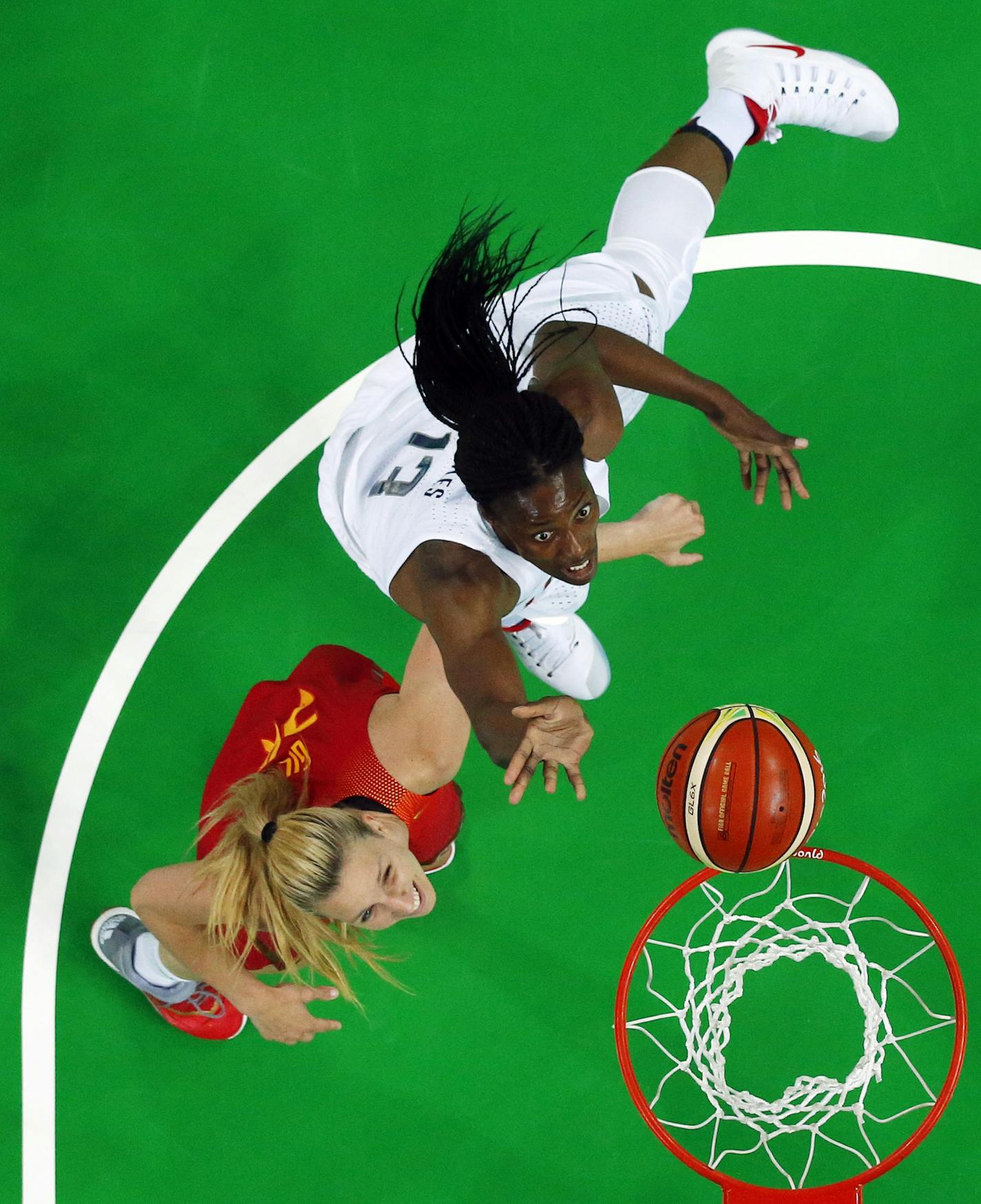 United States' Sylvia Fowles (13) drives to the basket over Spain's Laura Gil, left, during the gold medal basketball game at the 2016 Summer Olympics in Rio de Janeiro, Brazil, Saturday, Aug. 20, 2016. (Jim Young/Pool Photo via AP)