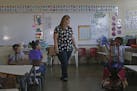 First grade teacher Karen Aviles talks to her students at the Julio Selles Sola Elementary School during the aftermath of Hurricane Maria in Rio Piedr