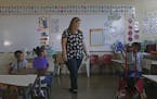 First grade teacher Karen Aviles talks to her students at the Julio Selles Sola Elementary School during the aftermath of Hurricane Maria in Rio Piedr