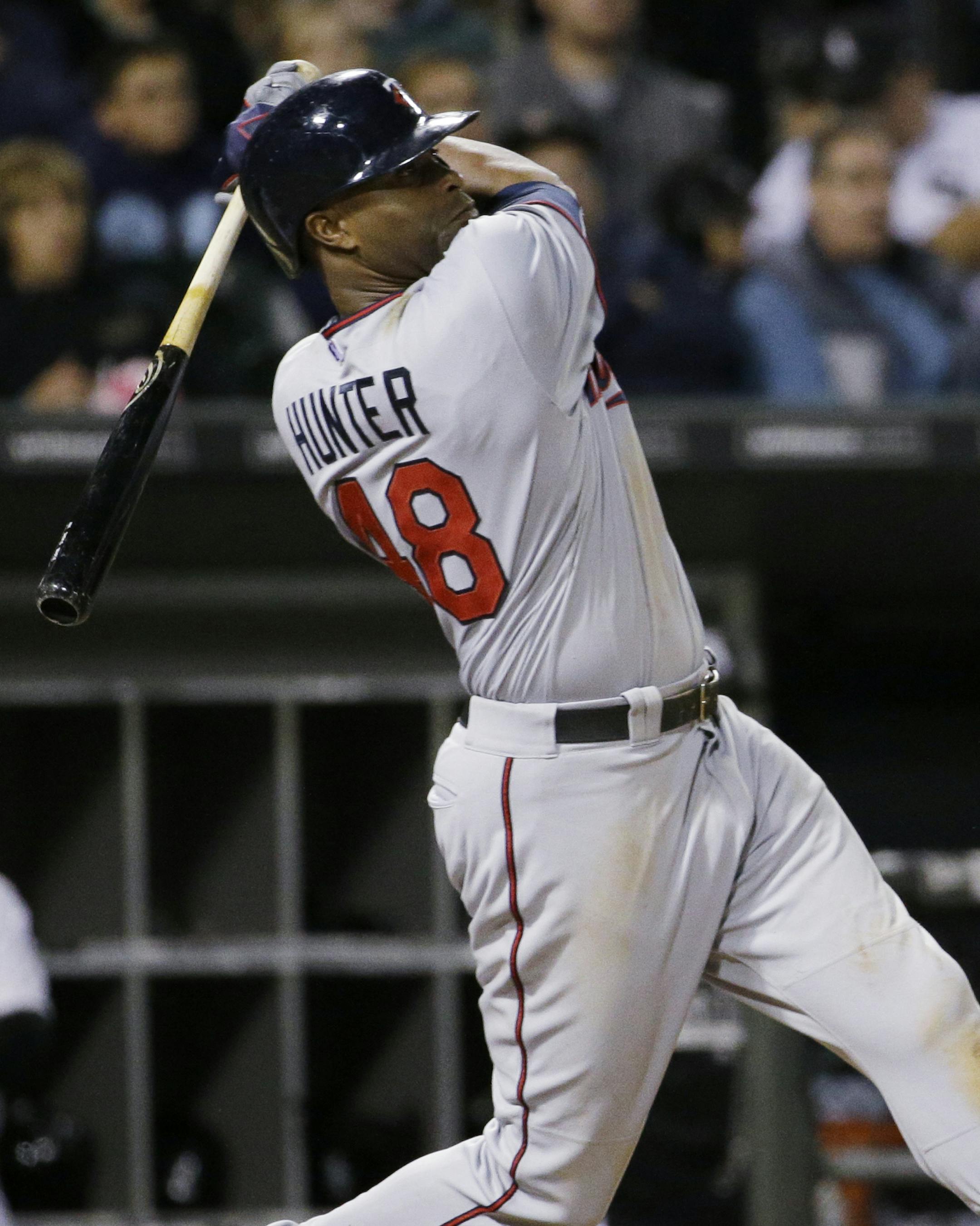 Minnesota Twins' Tori Hunter hits an one-run double against the Chicago White Sox during the sixth inning of a baseball game, Friday, Sept. 11, 2015, in Chicago. (AP Photo/Nam Y. Huh)