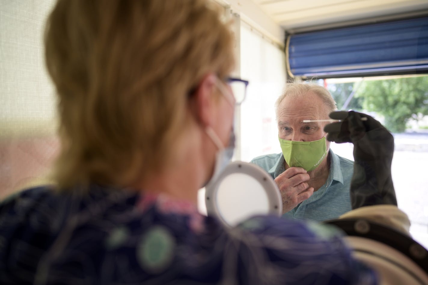 Albert Gartman, 84, of Forest Lake, was tested for COVID-19 by medical assistant Jeri Sanderson, Thursday afternoon at M Health Fairview's Wyoming Clinic. ] aaron.lavinsky@startribune.com Walk-up testing was offered at M Health Fairview's Wyoming Clinic on Thursday, Aug. 13, 2020 in Wyoming, Minn. A medical worker administered nasal swab tests in a glass booth designed by the University of Minnesota College of Science and Engineering. It's use is meant to offer more protection to the tester and