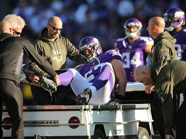 Vikings middle linebacker Audie Cole was helped onto a cart after he fractured his right ankle in the fourth quarter Sunday afternoon.
