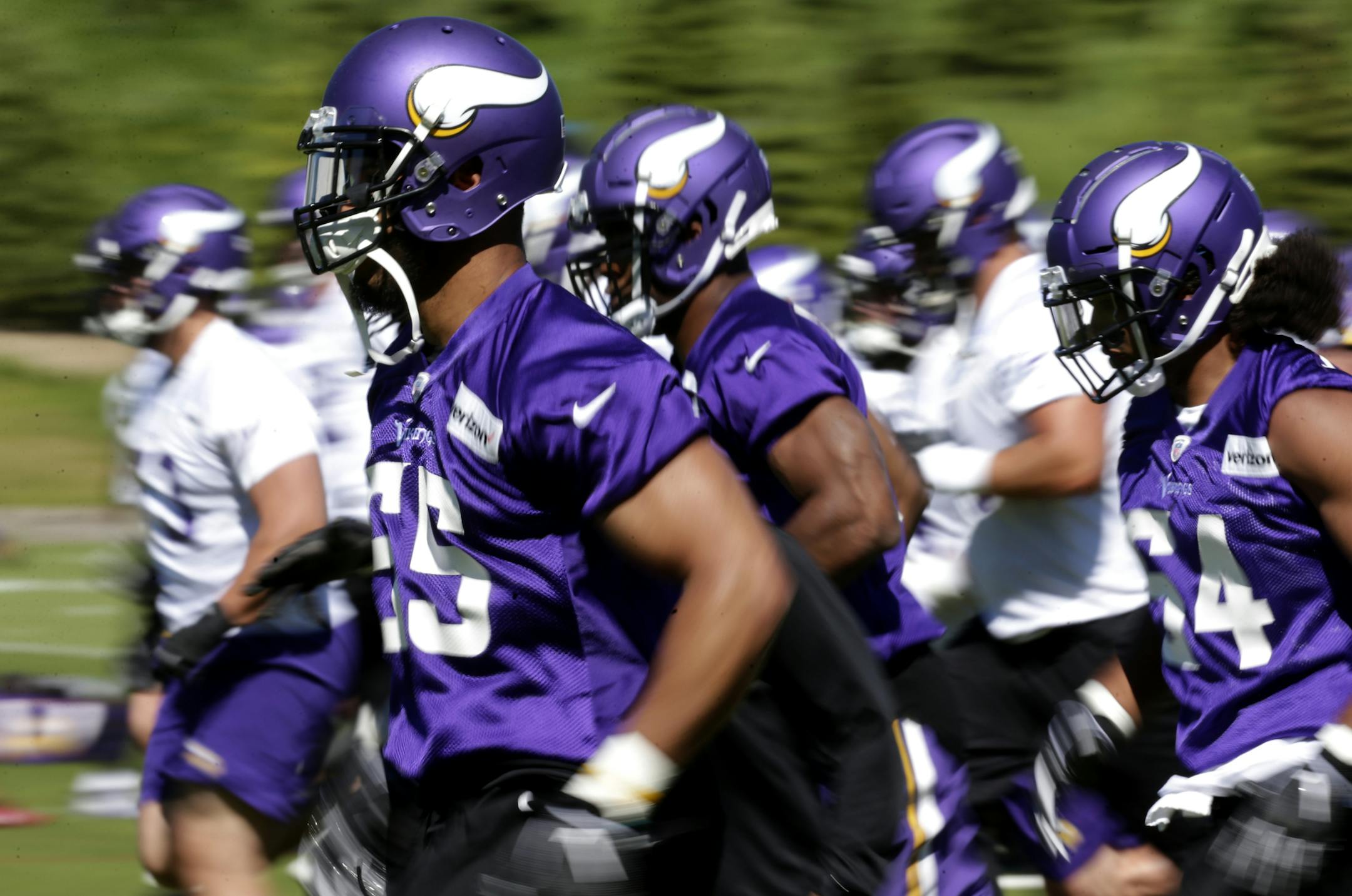 Minnesota Vikings linebacker Anthony Barr (55) and other players warm up before drills at the team's NFL football training facility in Eagan, Minn., Thursday, June 13, 2019. (AP Photo/Andy Clayton- King)
