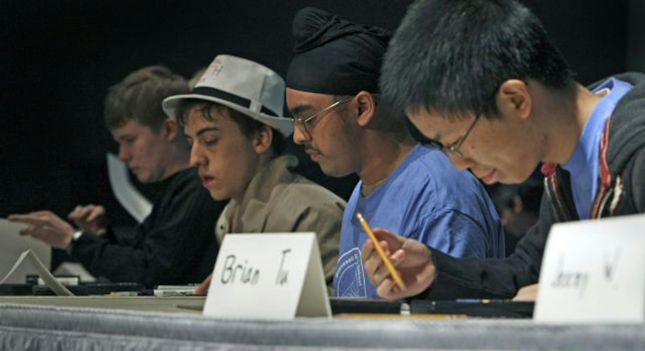 Some of the 10 top high school math students worked on problems during this year's competition held at South St. Paul High School.