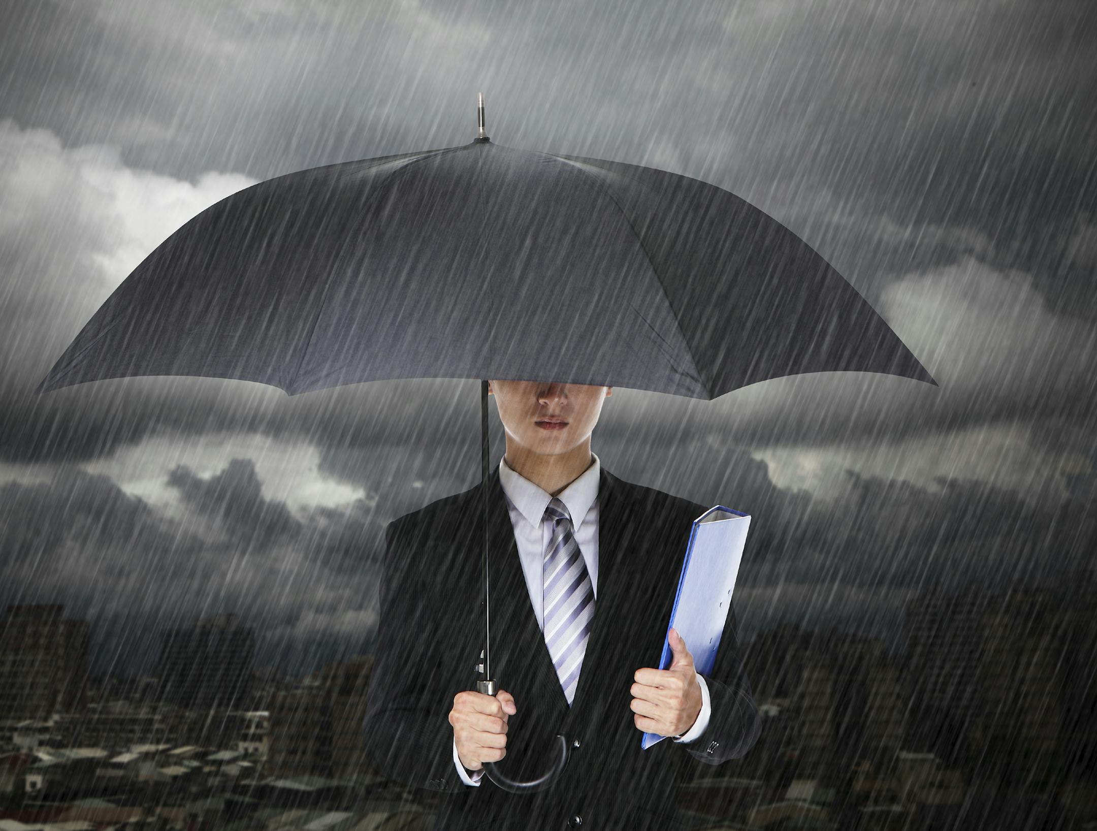 businessman in rain, istock