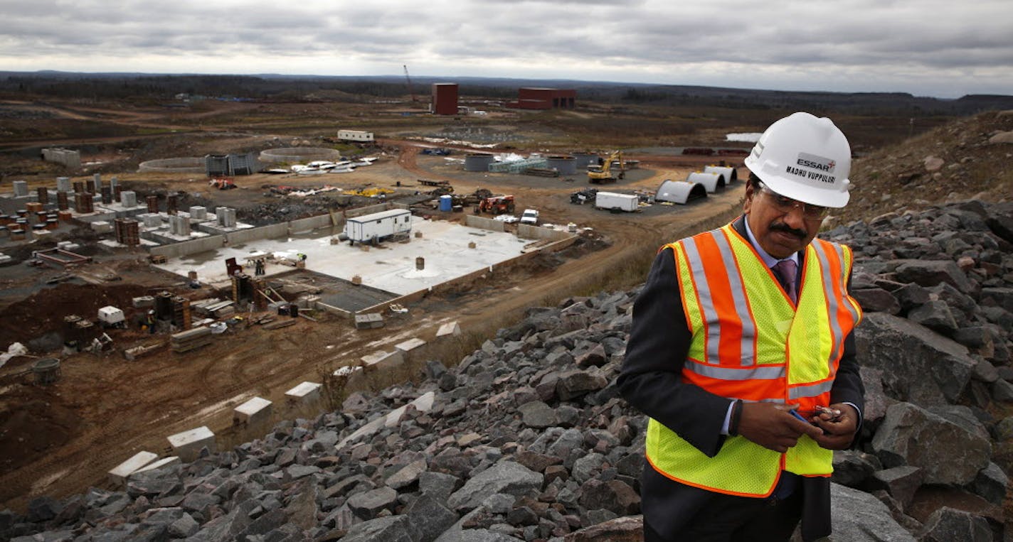 Madhu Vuppuluri, president and CEO of Essar Steel Minnesota, looks over the Essar Project in Nashwauk, Minn. Essar Steel Minnesota recently ramped up construction on an $1.8 billion taconite plant after securing the funding needed to complete the project. ] LEILA NAVIDI leila.navidi@startribune.com / BACKGROUND INFORMATION: Thursday, October 30, 2014. The plant endured several delays over the past two years as funds periodically ran dry and some contractors were paid late and walked off the job.