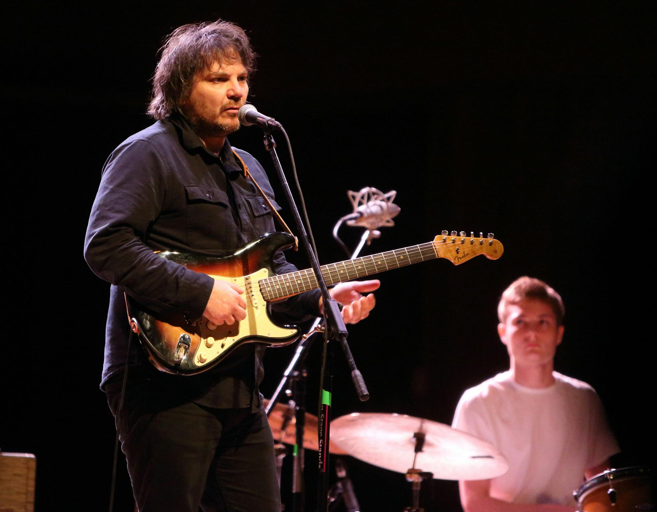 Jeff Tweedy of the band Wilco performs in concert with his son Spencer Tweedy at the Meyerhoff Symphony Hall on Monday, June 9, 2014, in Baltimore. (Photo by Owen Sweeney/Invision/AP) ORG XMIT: MDOS101