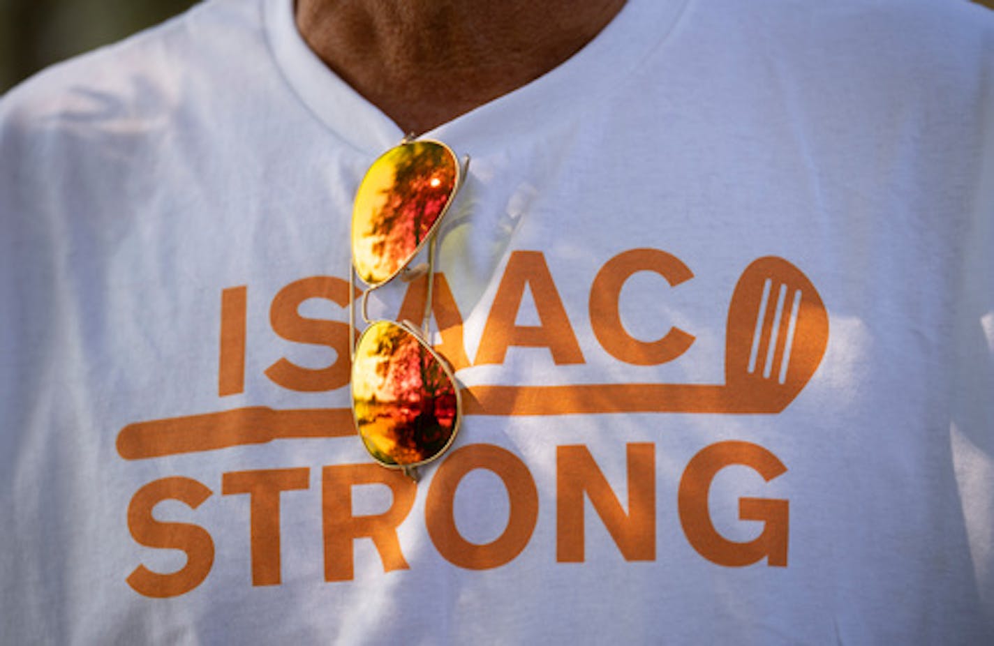 Tim Howard, a friend and neighbor of the Schuman's whose son was a close friend of Isaac Schuman, wore a shirt honoring Isaac as he talked about him outside the celebration of Isaac Schuman's life Tuesday afternoon, August 16, 2022 at the Oak Glen Event Center in Stillwater, Minn. Schuman died as a result of being stabbed after a confrontation while floating with friends down the Apple River in Somerset, Wisc. ] JEFF WHEELER • Jeff.Wheeler@startribune.com