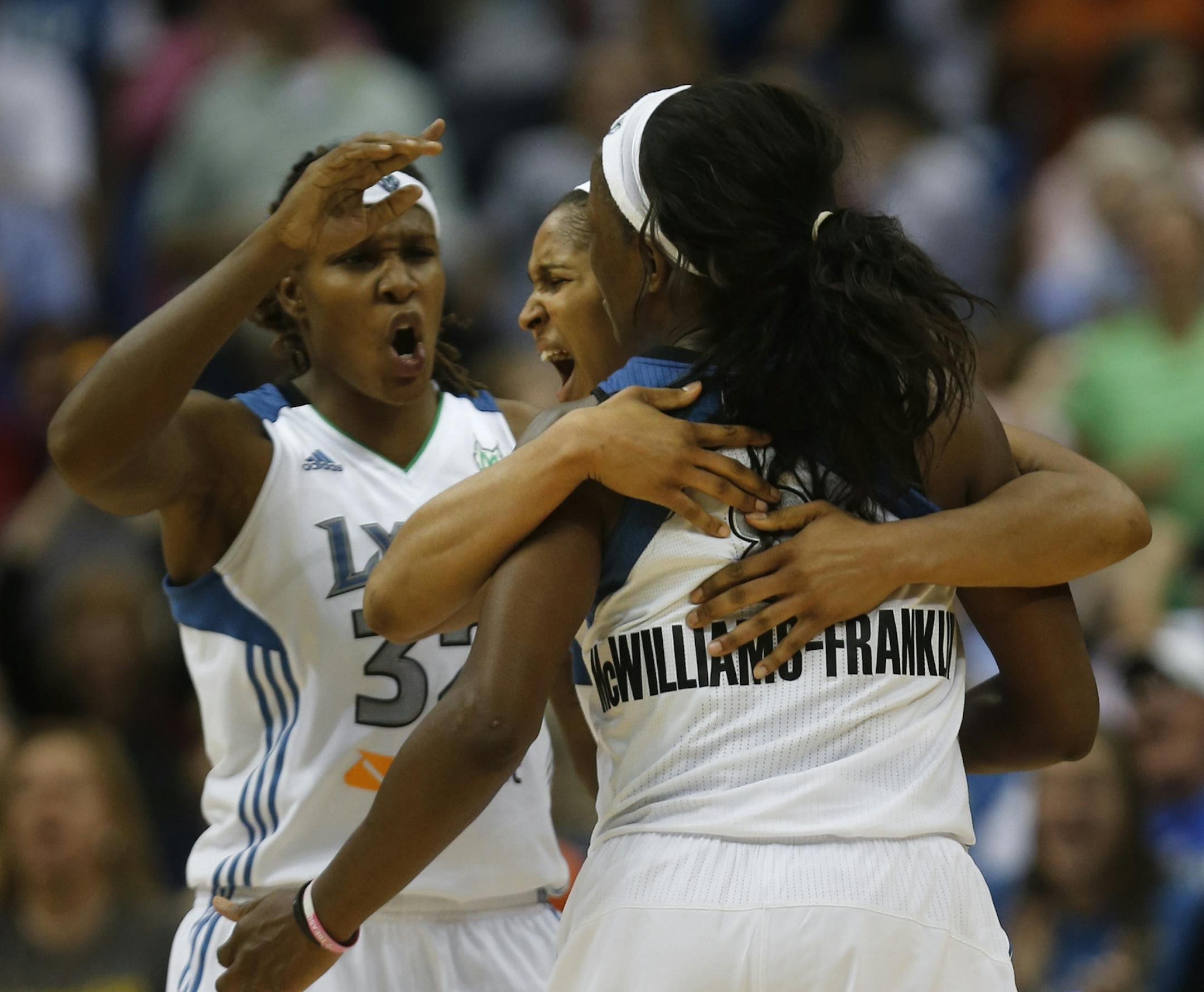Lynx Maya Moore and Rebekkah Bronson celebrated with Taj McWilliams-Franklin after one of her four blocked shots during the first overtime at the Target Center in Minneapolis, Min., Friday September 7, 2012. Lynx Won 97-93