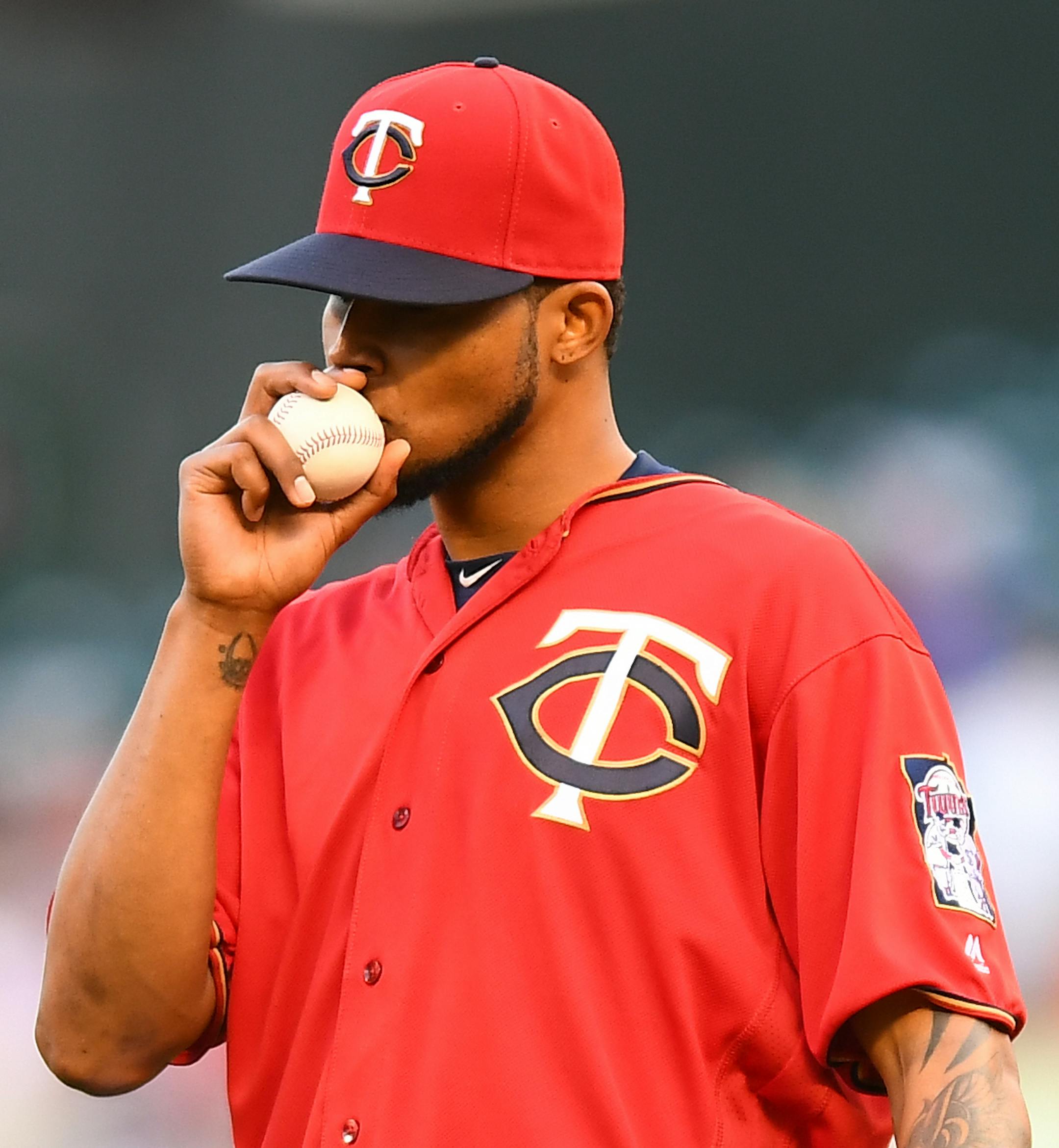 Minnesota Twins starting pitcher Ervin Santana (54) kissed the ball moments before the start of Friday night's game against Cleveland. ] (AARON LAVINSKY/STAR TRIBUNE) aaron.lavinsky@startribune.com The Minnesota Twins played the Cleveland Indians on Friday, July 15, 2016 at Target Field in Minneapolis, Minn.