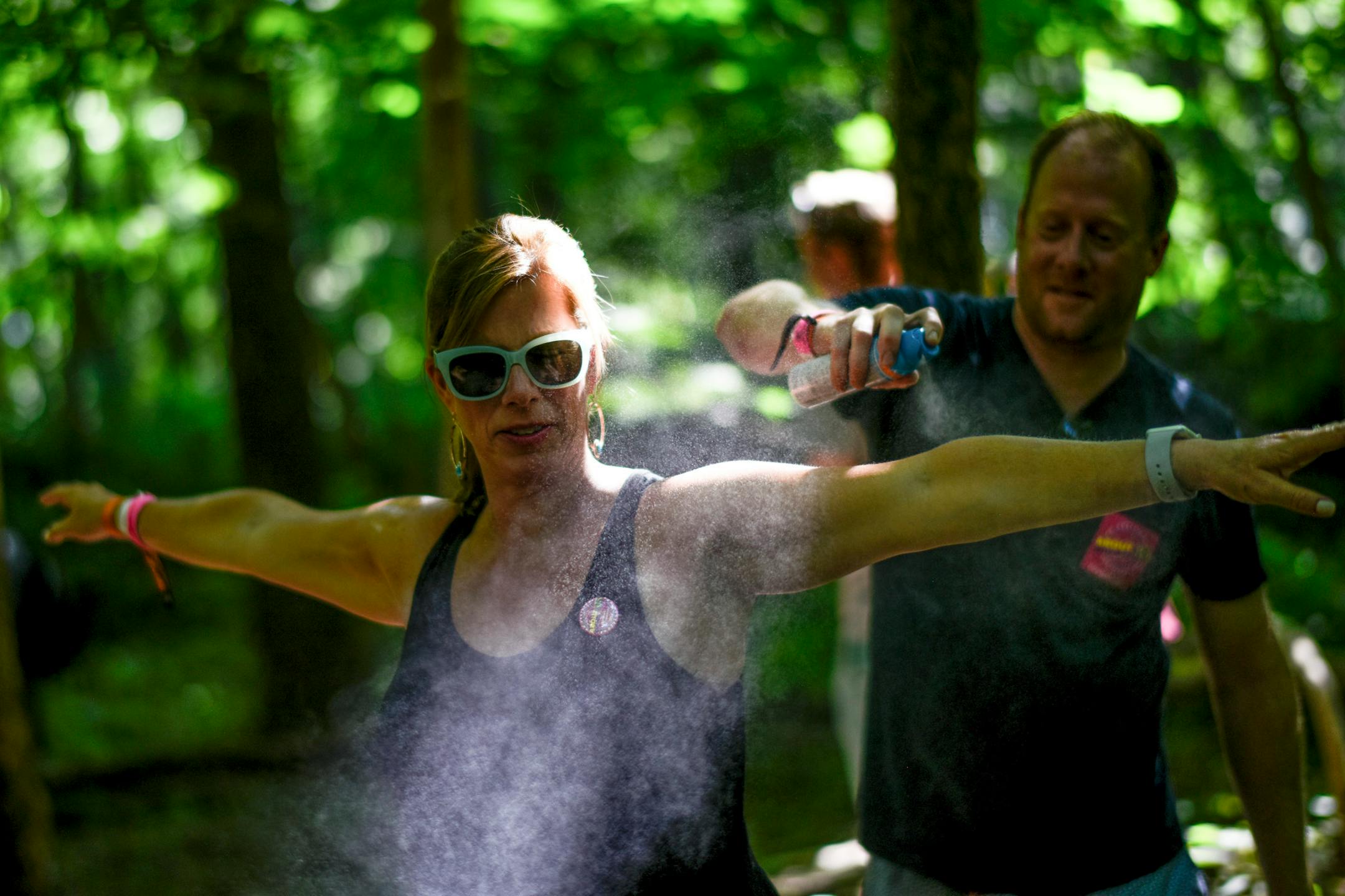 Kristy Wesson, of Minneapolis, was sprayed with bug spray by her husband, Matt, Saturday at the Eaux Claires Music and Art Festival. ] AARON LAVINSKY ï aaron.lavinsky@startribune.com Day two of the Eaux Claires Music & Art Festival was held Saturday, July 7, 2018 at Foster Farms in Eau Claire, Wisc.