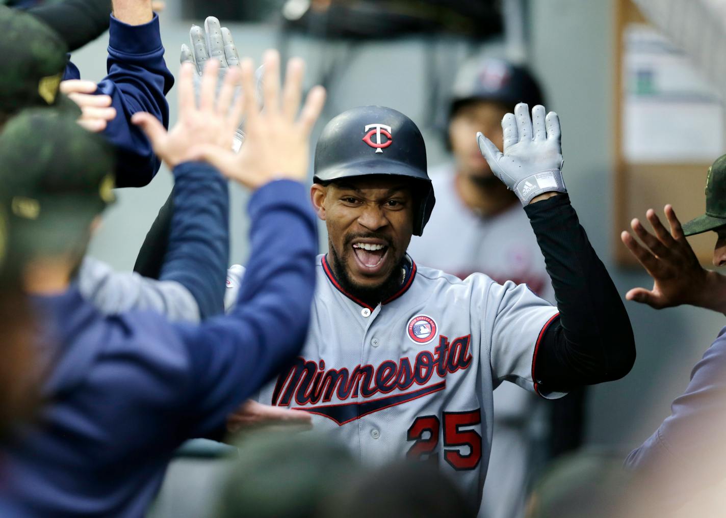 The improved hitting of Byron Buxton -- shown after hitting a grand slam off the Mariners' Wade LaBlanc on Saturday night -- is one of the many reasons the Twins have surged to the top of the American League Central.