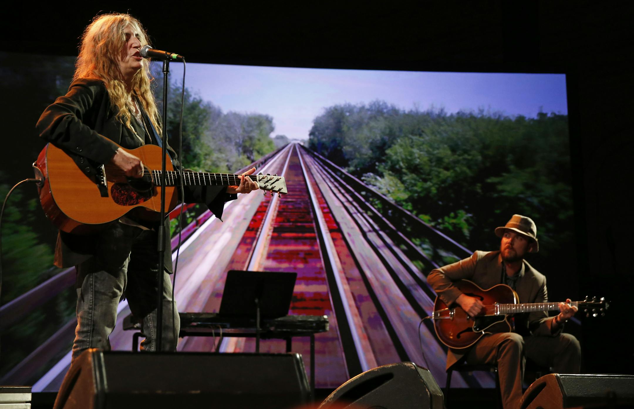 Rock legend Patti Smith and her son, Jackson, at right, performed Thursday as part of the Station to Station traveling art tour, which stopped in St. Paul. About 900 turned out to see the installations, which were set up at Union Depot.