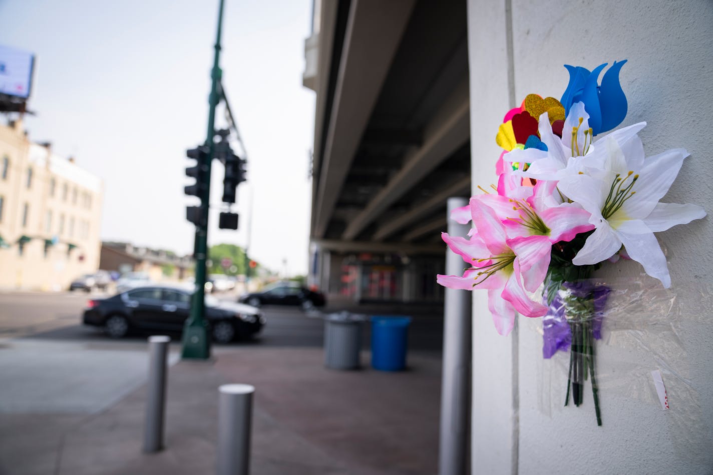 Fake flowers are seen taped under the I-35 highway overpass at the intersection of Lake Street and S. 2nd Avenue on Saturday, June 17, 2023 in Minneapolis, Minn. Five people are dead after police said a speeding driver ran a red light on Lake Street in south Minneapolis late Friday. ] LEILA NAVIDI • leila.navidi@startribune.com