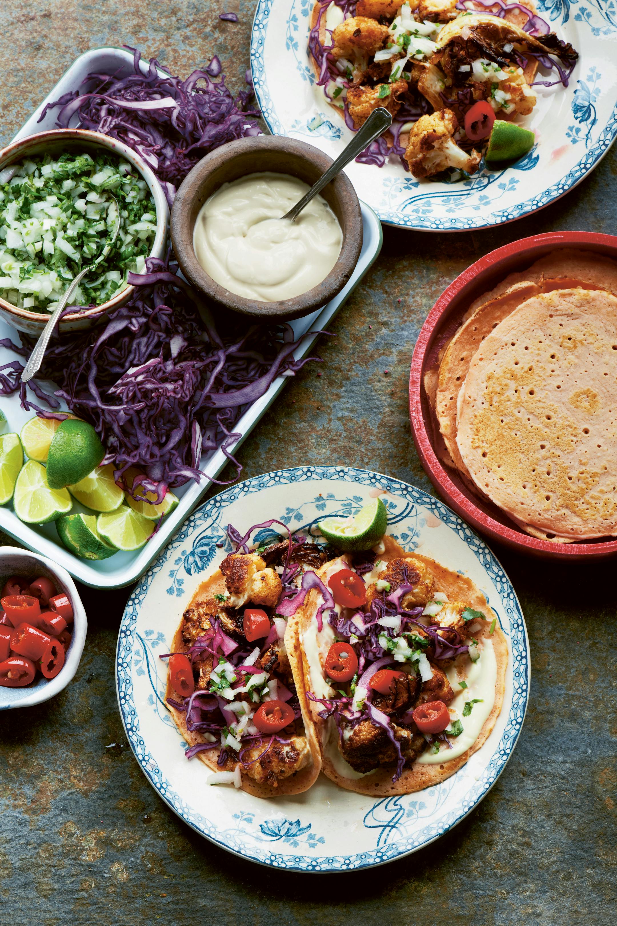 Use traditional corn tortillas for Roast Cauliflower Tacos, or use lentils to make a pancake-like shell. From "More Daily Veg" (Kyle, 2023) by Joe Woodhouse. Credit: Joe Woodhouse