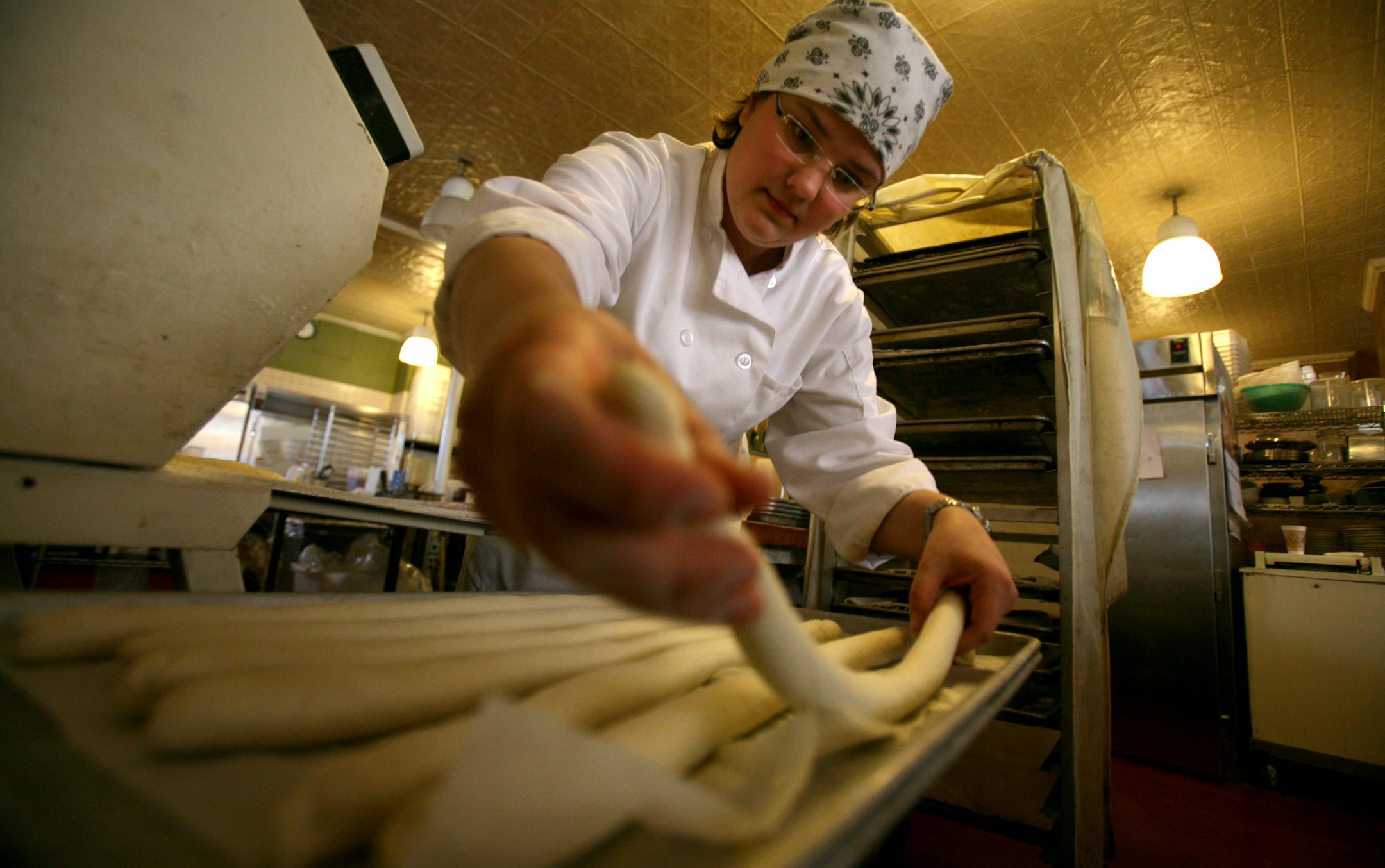 Baker Solveig Tofte, of the Turtle Bread Co., placed bread dough on a cookie sheet during her baking practice. Tofte along with two other teammates will represent the U.S. in Paris in a world baking competition.