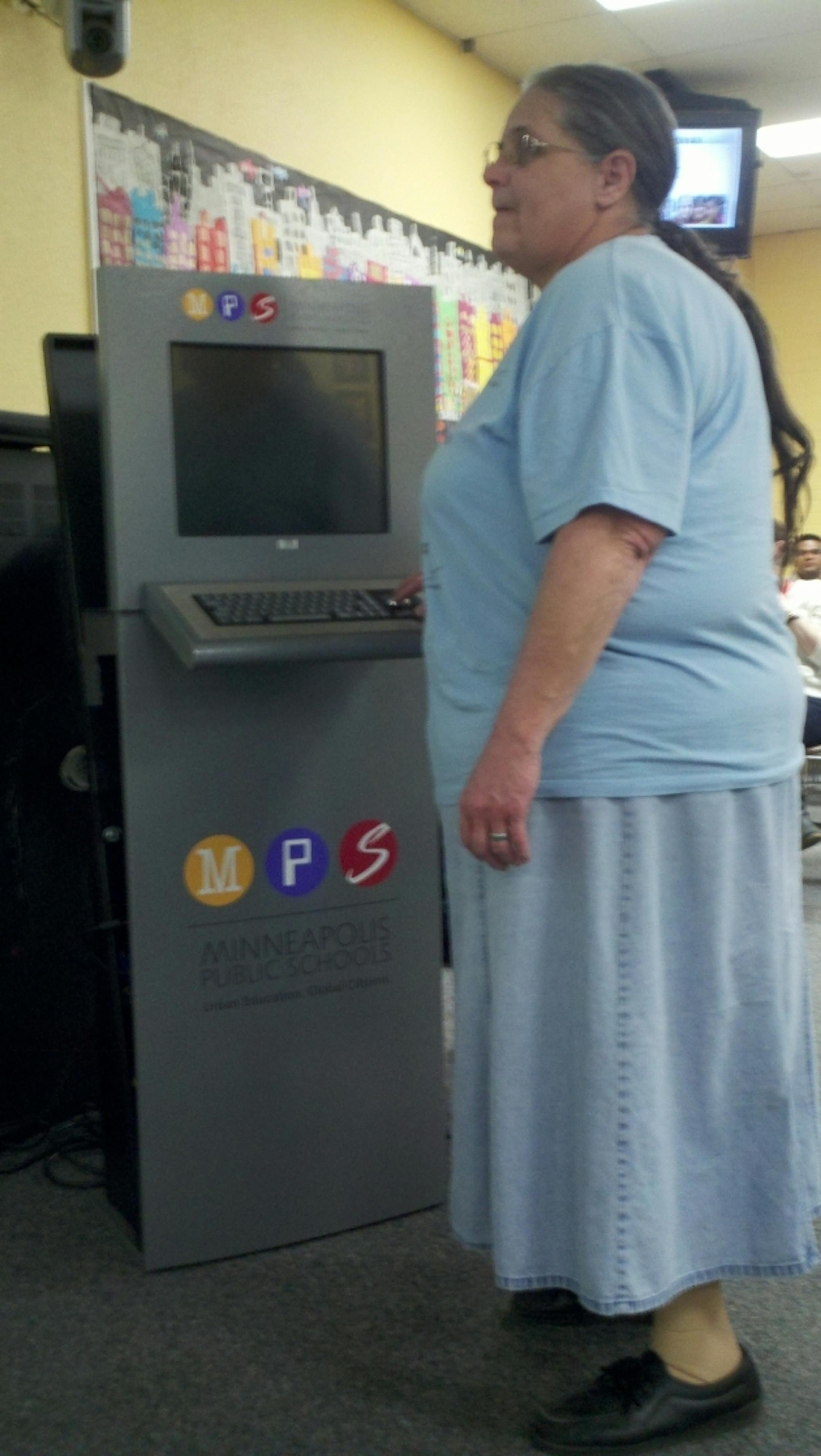 Schools employee Bazilla (Buzzy) Bohn tries a kiosk.