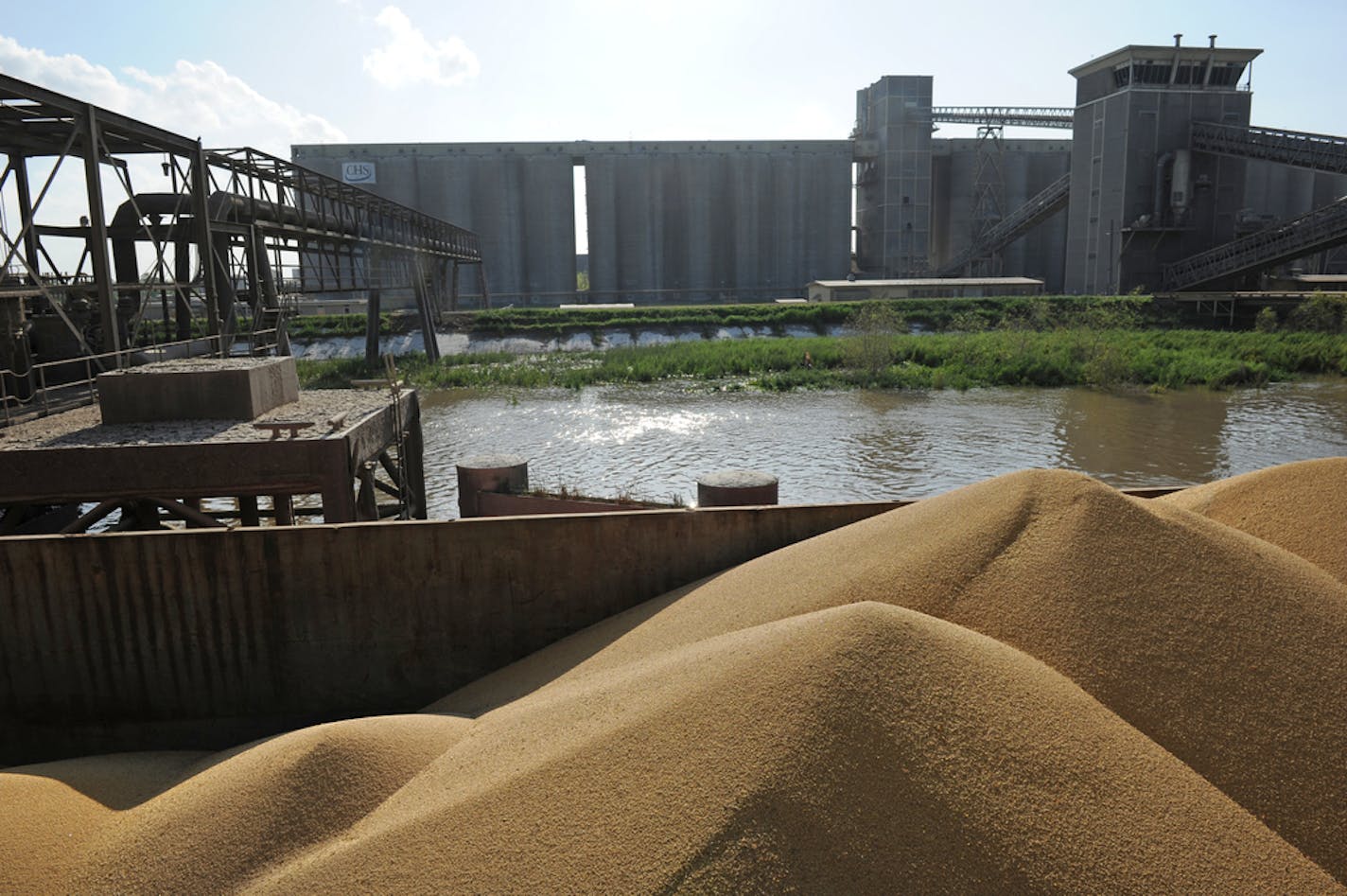 A barge filled with soybeans awaits unloading at the CHS grain export terminal on the Mississippi River at Myrtle Grove, Louisiana. From here it will be loaded onto a ship and sent to one of the 60 countries to which we export grain. CHS, Inc. is the company name. It results from a merger of Cenex and Harvest States. . CHS, headquartered in Inver Heights, is the countryâ€™s top-grossing agriculture co-op.