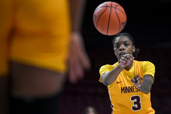 Minnesota Gophers guard Deja Winters (3) passes the ball during the second half of an NCAA women's basketball game between the Minnesota Gophers and t