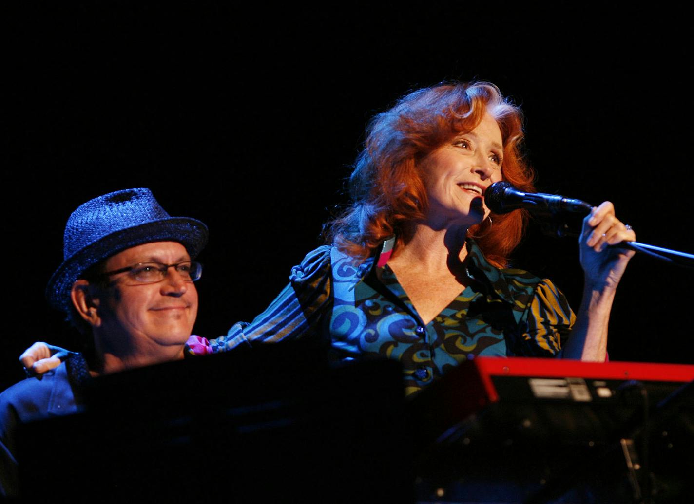 Bonnie Raitt introduced Twin Cities keyboardist Ricky Peterson before an emotional tribute song to her late brother, Steve Raitt, at the State Fair in 2009.