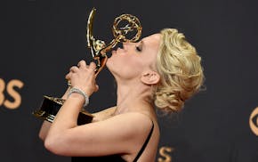 Kate McKinnon poses in the press room with the award for outstanding supporting actress in a comedy series for "Saturday Night Live" at the 69th Prime