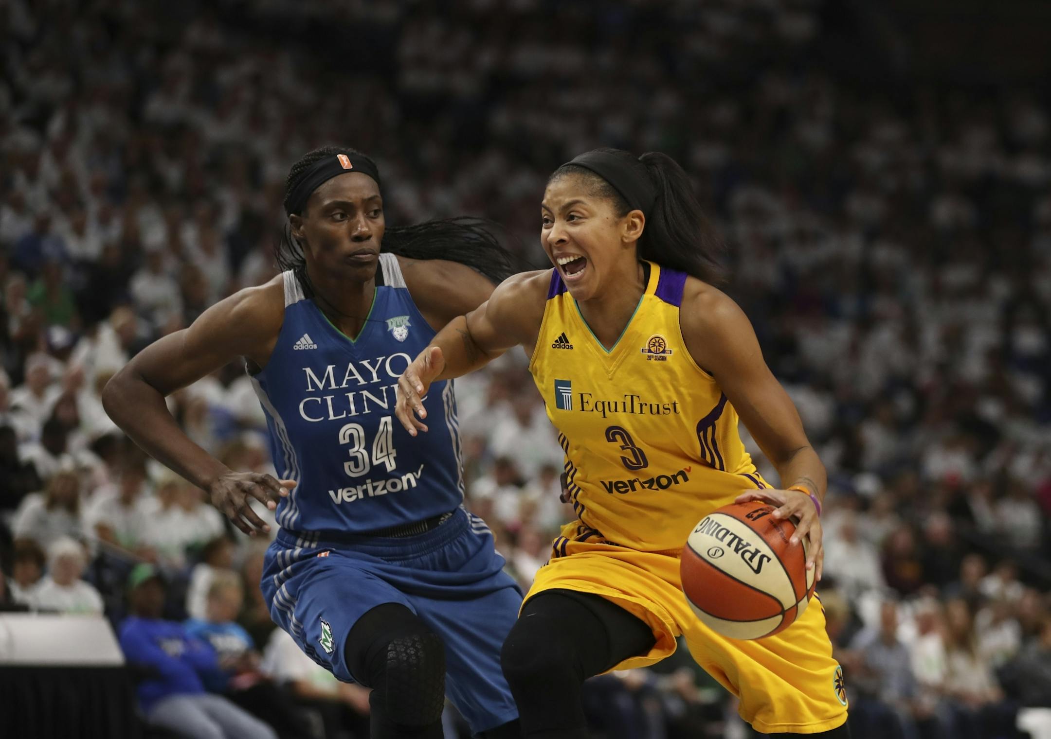 Minnesota Lynx center Sylvia Fowles (34) earned a foul defending Los Angeles Sparks forward Candace Parker (3) in the second quarter.