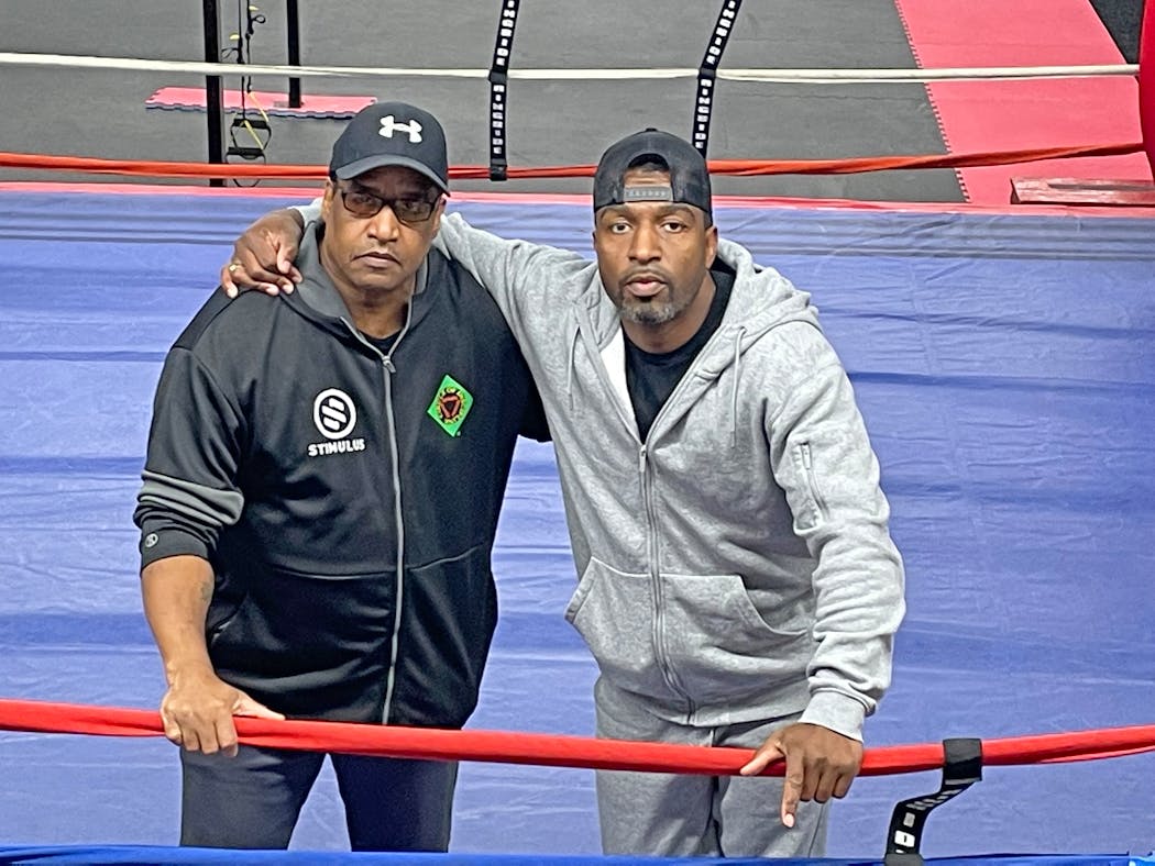 Sankara Frazier, left, and his son Adonis at new Circle of Discipline gym in Minneapolis.
