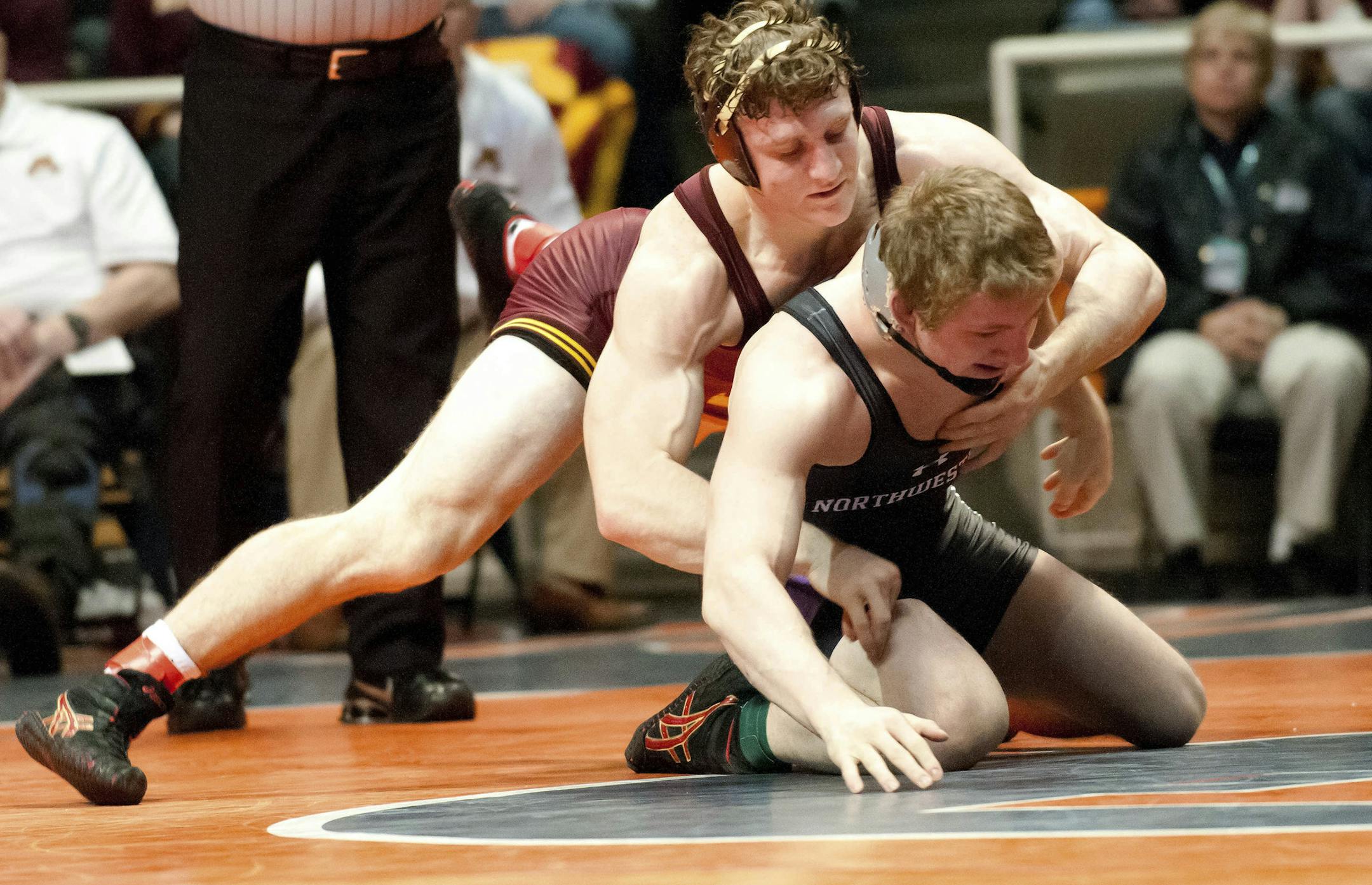 Minnesota's Kevin Steinhaus, top, competes with Northwestern's Jacob Berkowitz in a 184-pound match during the Big Ten college wrestling tournament in Champaign, Ill., on Saturday, March 9, 2013. Steinhaus defeated Berkowitz in the match. (AP Photo/The News-Gazette, Bradley Leeb)