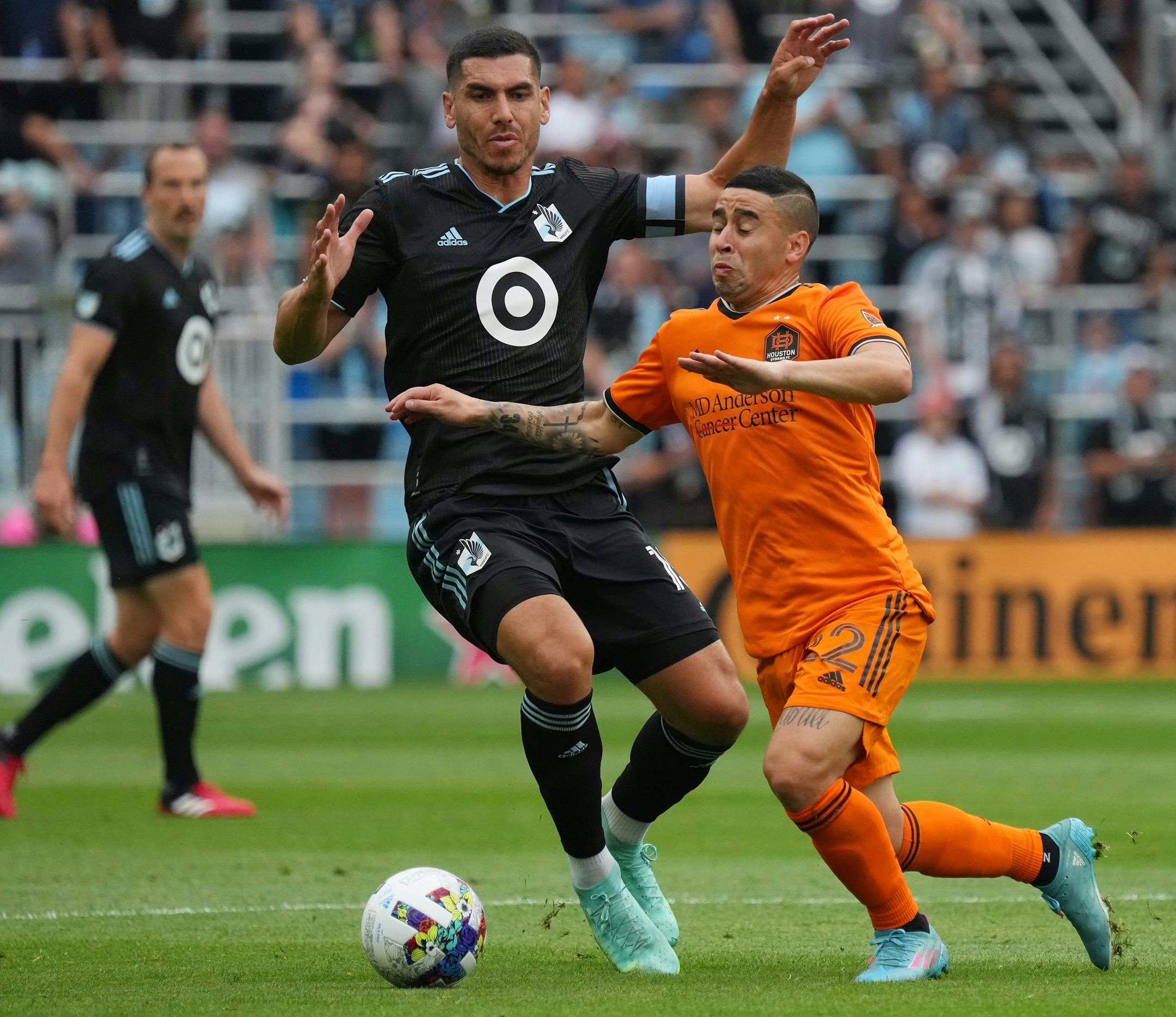 Houston Dynamo midfielder Matías Vera (22) takes the ball past Minnesota United defender Michael Boxall (15) in the first half of an MLS game between Minnesota United and the Houston Dynamo.