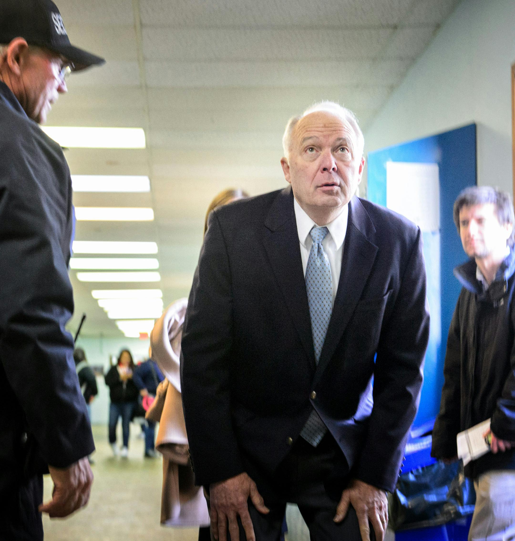 School safety and security officer John Parameter, left, asked Rep John Kline to look at how on of the school buildings had shifted. The building that was once used for a vocational auto body shop and never intended to be used as classroom space. The building has a leaky roof, poor insulation and an overburdened electrical system.
