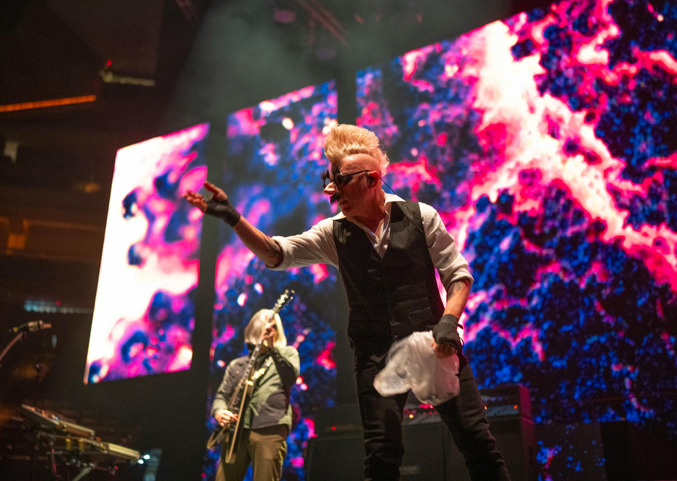 Singer Maynard James Keenan of Tool tossed Halloween candy to the audience in the front rows during the band's first song of their concert Tuesday night, October 31, 2023, at Xcel Energy Center in St. Paul.