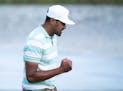 Tony Finau reacts on the 18th hole after winning the 3M Open Sunday, July 24, 2022 at the Tournament Players Club in Blaine, Minn. ]