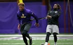 Minnesota Vikings Charles Johnson, left, and Cordarrelle Patterson ran through drills during a player offseason workout at Winter Park, Tuesday, April