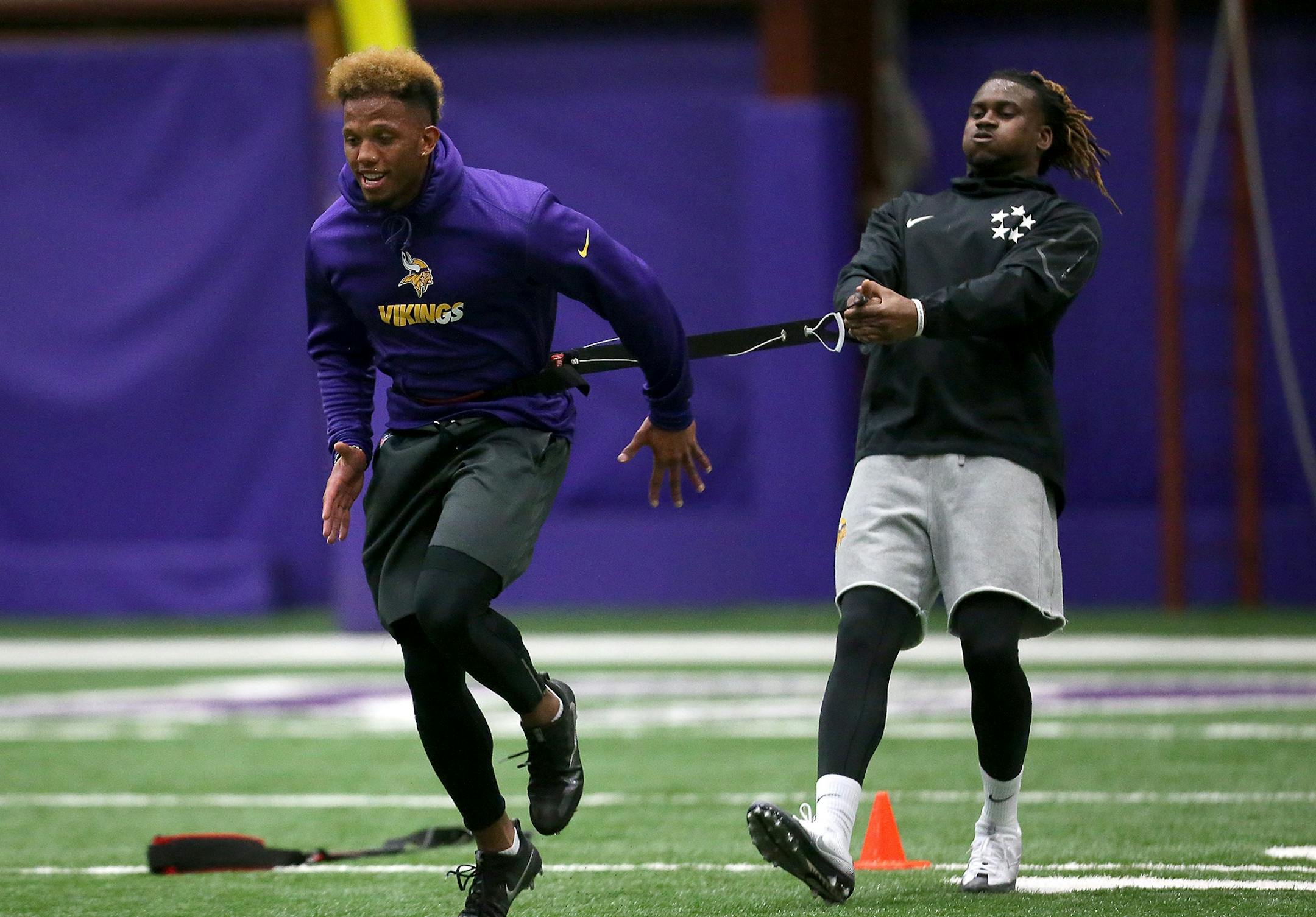 Minnesota Vikings Charles Johnson, left, and Cordarrelle Patterson ran through drills during a player offseason workout at Winter Park, Tuesday, April 26, 2016 in Eden Prairie, MN.