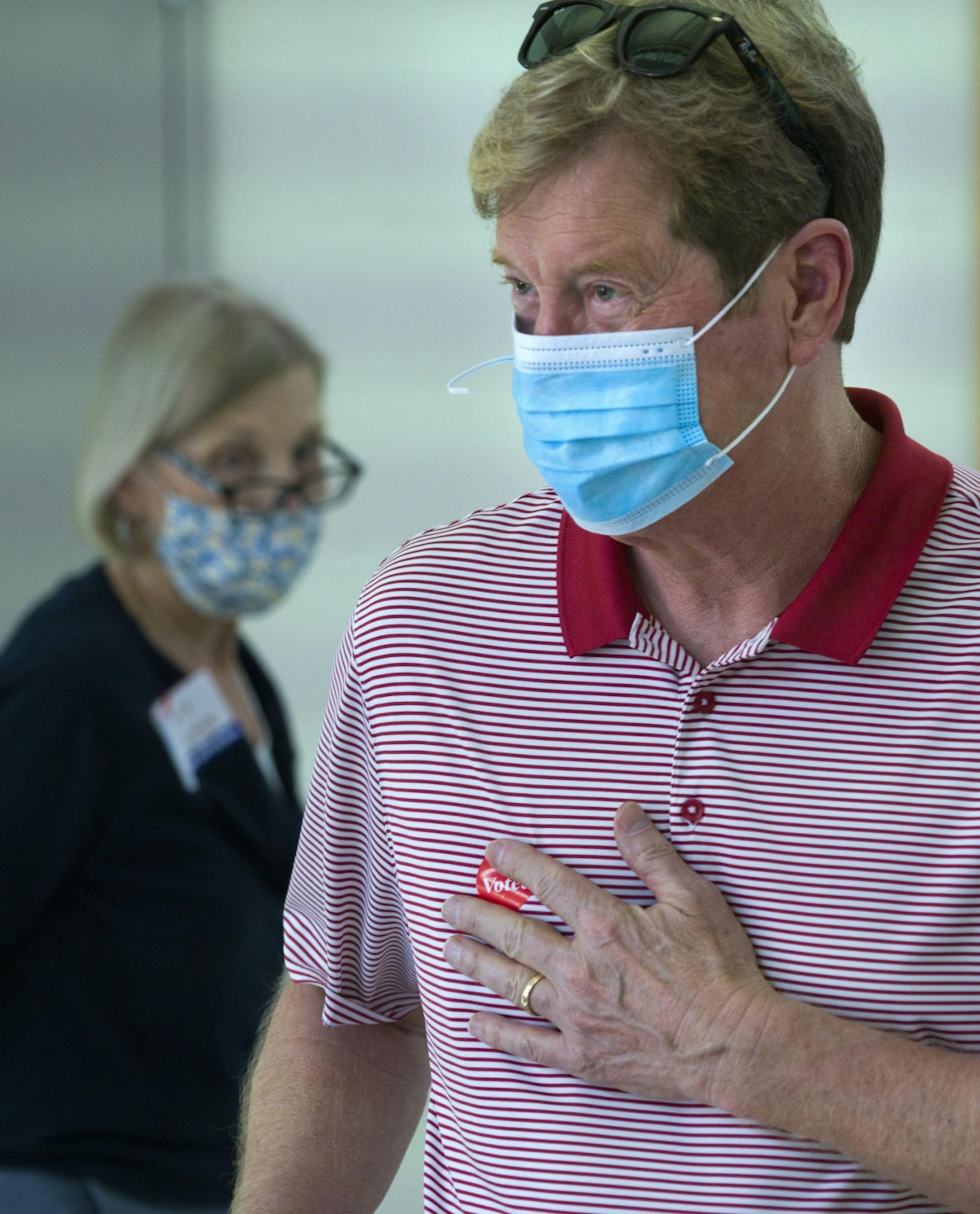 Jason Lewis cast his ballot at Liberty Ridge Elementary School in Woodbury Tuesday afternoon and slapped a "I voted" sticker on his chest after doing so.