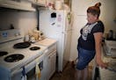 Tenant Lourdes Vargas has many complaints including mice and cockroaches that she works hard to keep from entering her apartment.] They say the situat