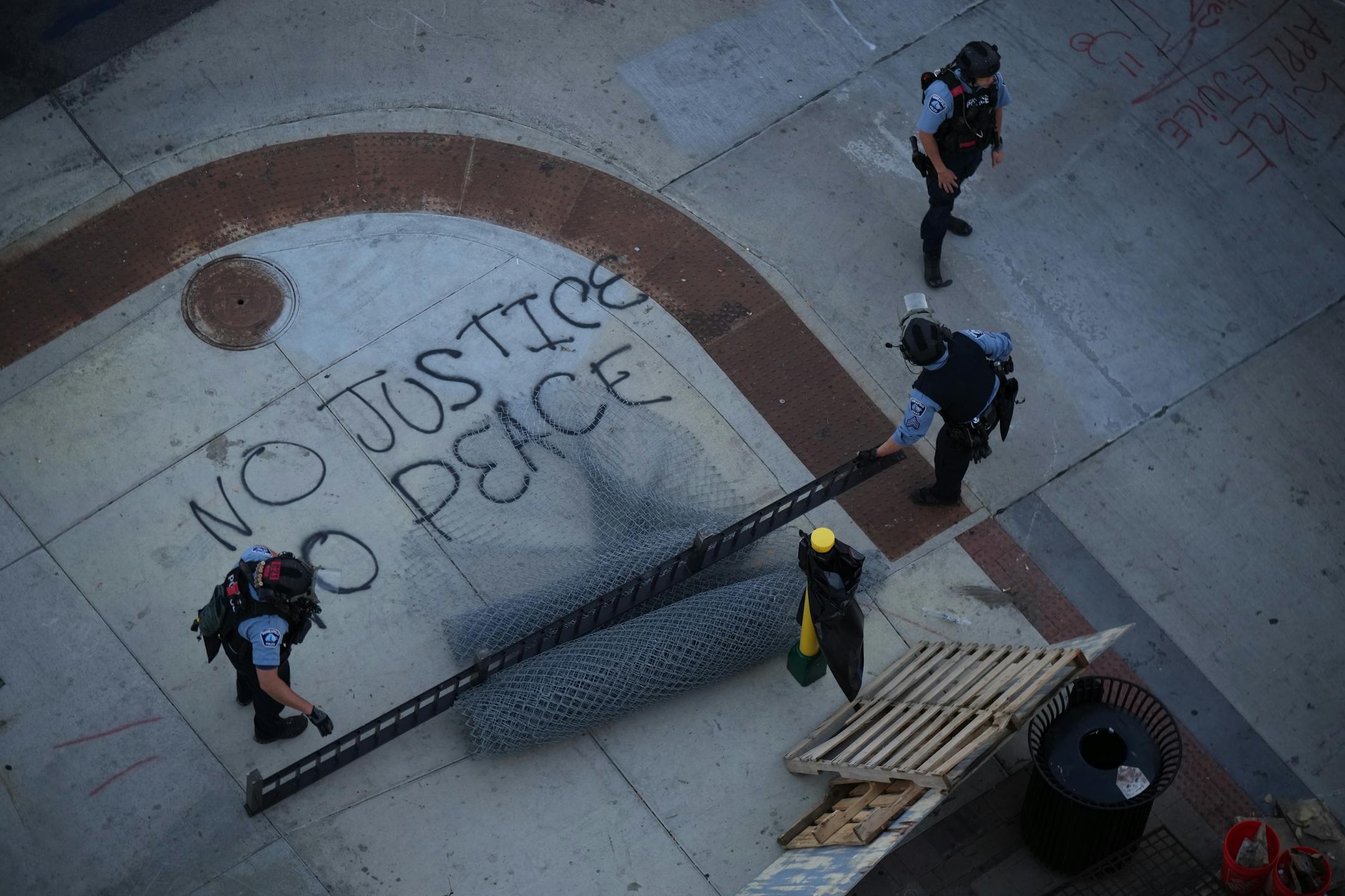 Minneapolis Police descended on the block long stretch of Lake St. in Uptown just before sunset Tuesday night, June 15, 2021 to dismantle the barricades erected by protesters.