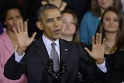 President Barack Obama gestures about the varity of plans available as he addresses supporters on his signature legislation, the Affordable Care Act.