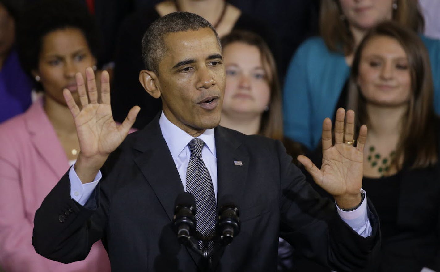 President Barack Obama gestures about the varity of plans available as he addresses supporters on his signature legislation, the Affordable Care Act.