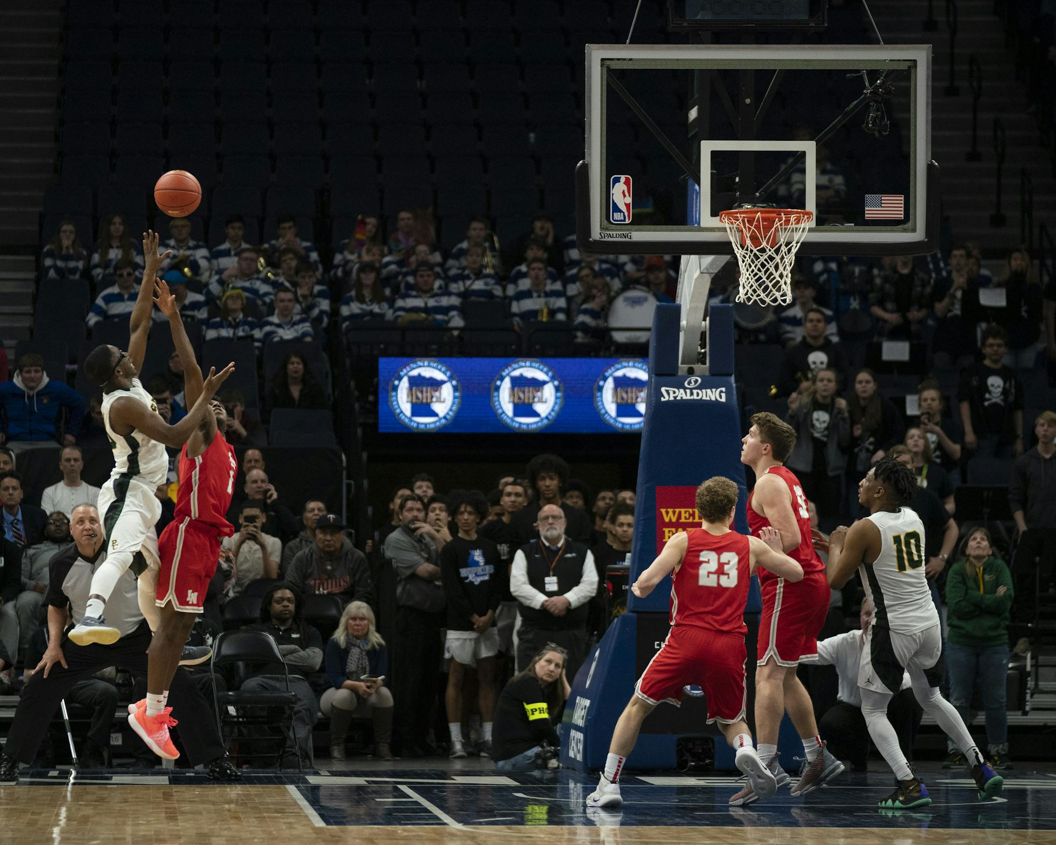 Park Center guard Emmanuel Tamba (20) launched a last second shot over Lakeville North guard Josh Kamara (1) to try to tie the game but it failed to drop. ] JEFF WHEELER • jeff.wheeler@startribune.com Lakeville North upset Park Center 47-45 in a semifinal game of the Class 4A boys' basketball tournament Thursday night, March 21, 2019 at Target Center in Minneapolis.