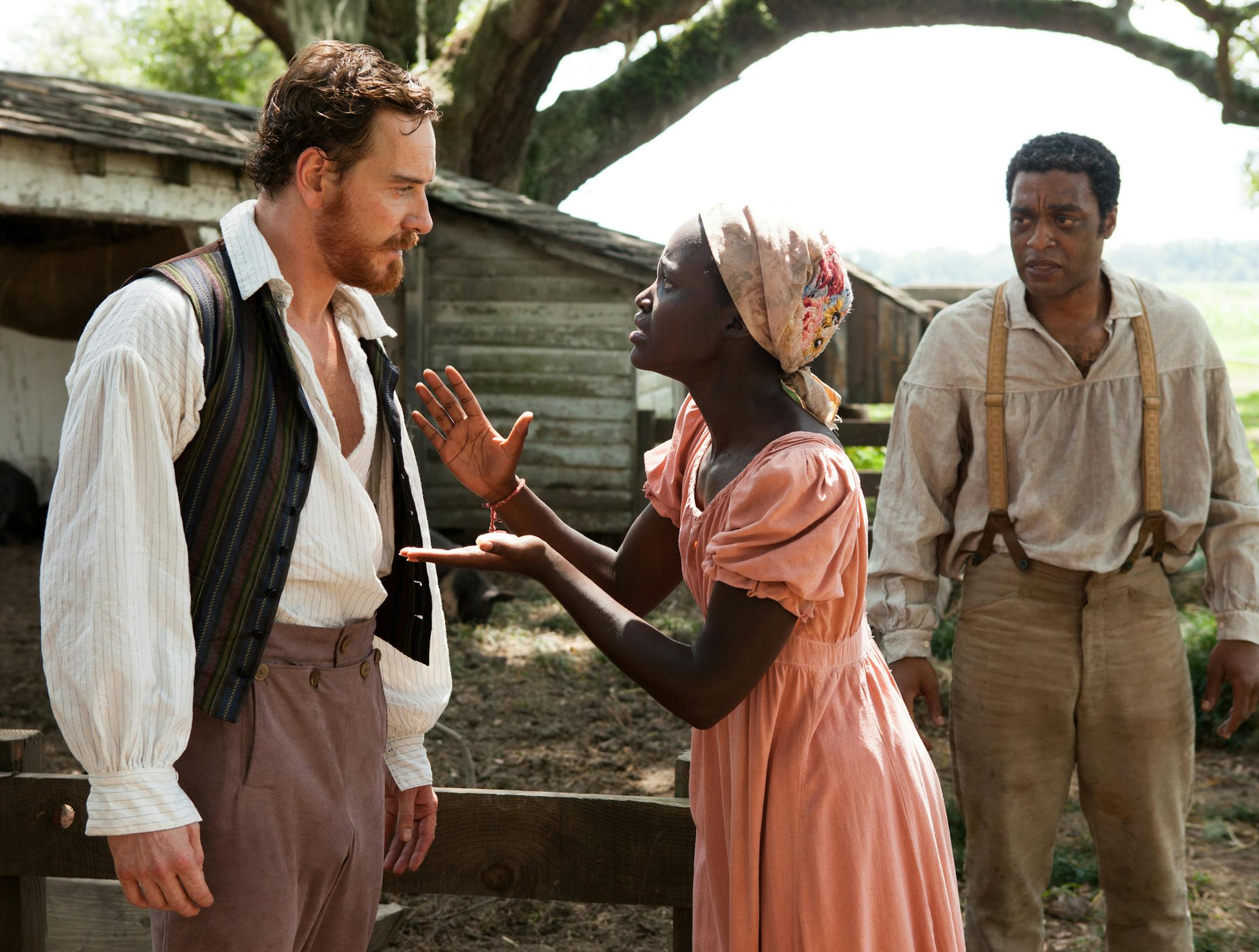 This image released by Fox Searchlight shows Michael Fassbender, left, Lupita Nyong'o and Chiwetel Ejiofor, right, in a scene from "12 Years A Slave." Fassbender was nominated for a Golden Globe for best supporting actor in a motion picture, Nyong'o was nominated for best supporting actress in a motion picture and Ejiofor was nominated for best actor in a motion picture drama for their roles in the film on Thursday, Dec. 12, 2013. The film was also nominated for best drama. The 71st annual Golde