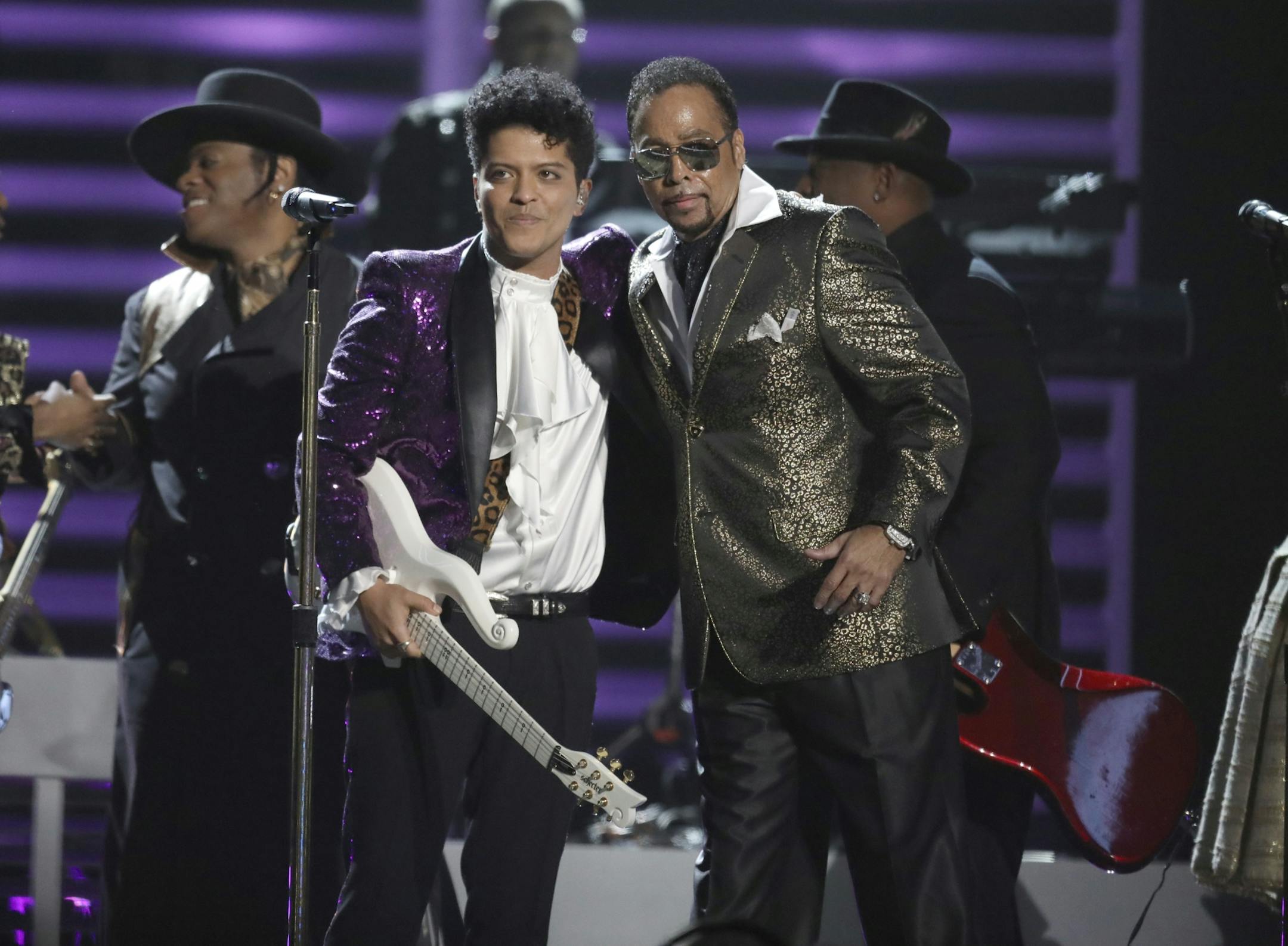 Bruno Mars, left, and Morris Day, of The Time, perform during a tribute to Prince at the 59th annual Grammy Awards.