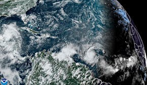 This National Oceanic and Atmospheric Administration satellite image taken at 4:20pm EDT shows hurricane Beryl, lower center right, as it strengthens 