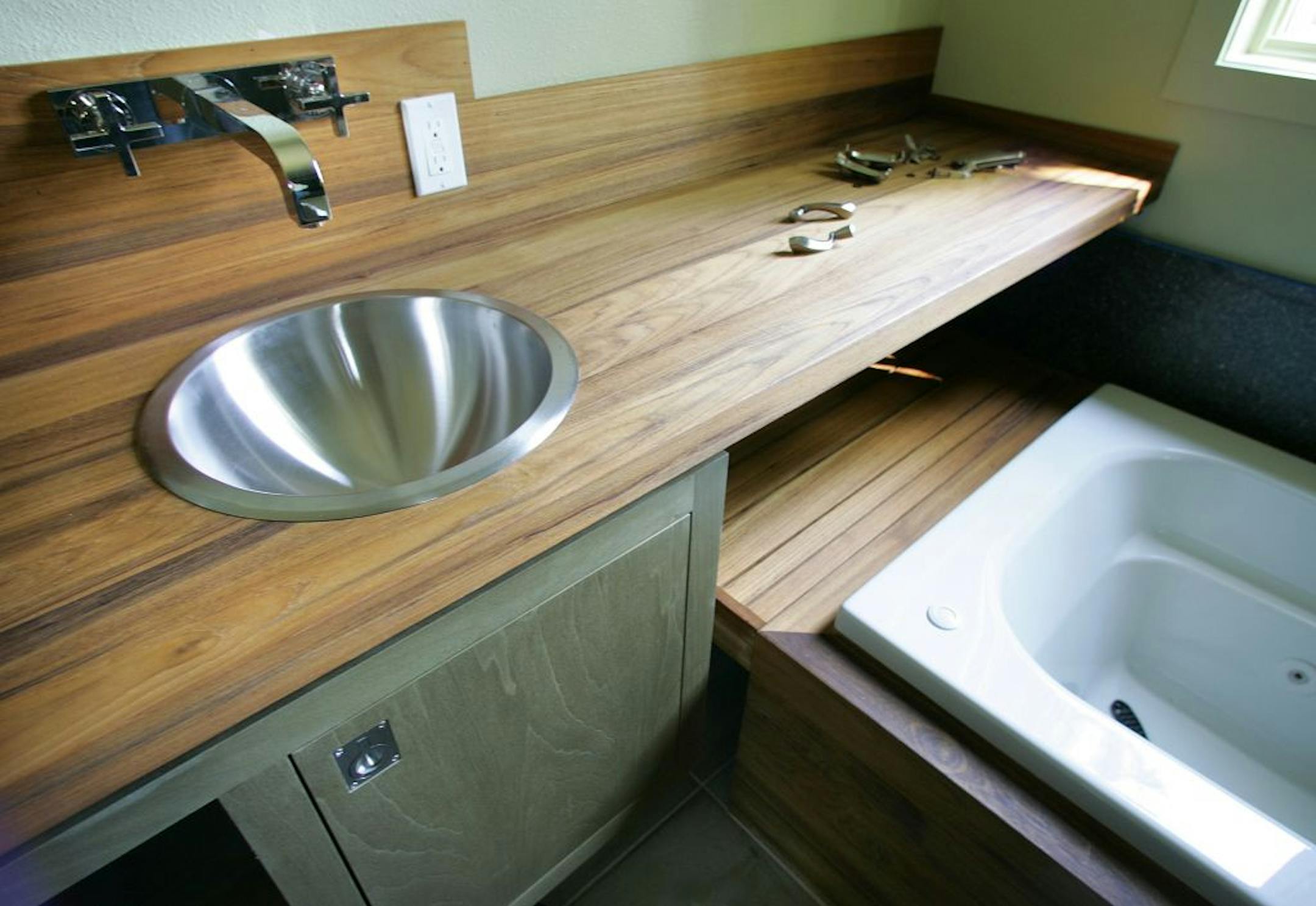 This master bath with reclaimed teak countertops is featured in Sunset magazine with the theme, "Celebration Idea House," as illustrated May 15, 2006, in Menlo Park, California. The home is designed to showcase the future of construction technology.