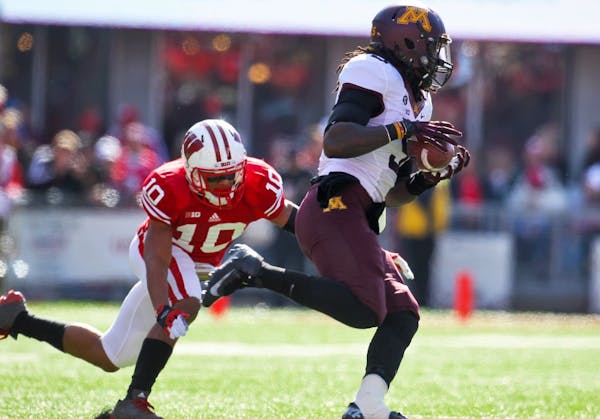 Gophers receiver MarQueis Gray hauled in a pass beating Badgers defender Devin Smith (10) in first half action on Saturday. (MARLIN LEVISON/STARTRIBUN