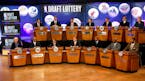 NBA basketball team representatives sit onstage at the start of the 2013 NBA draft lottery in New York.