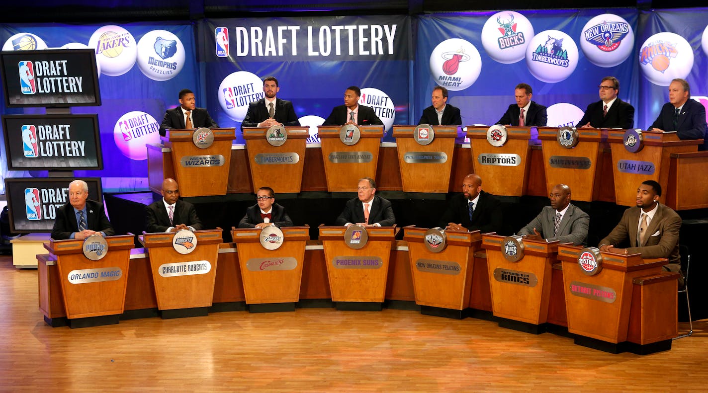 NBA basketball team representatives sit onstage at the start of the 2013 NBA draft lottery in New York.