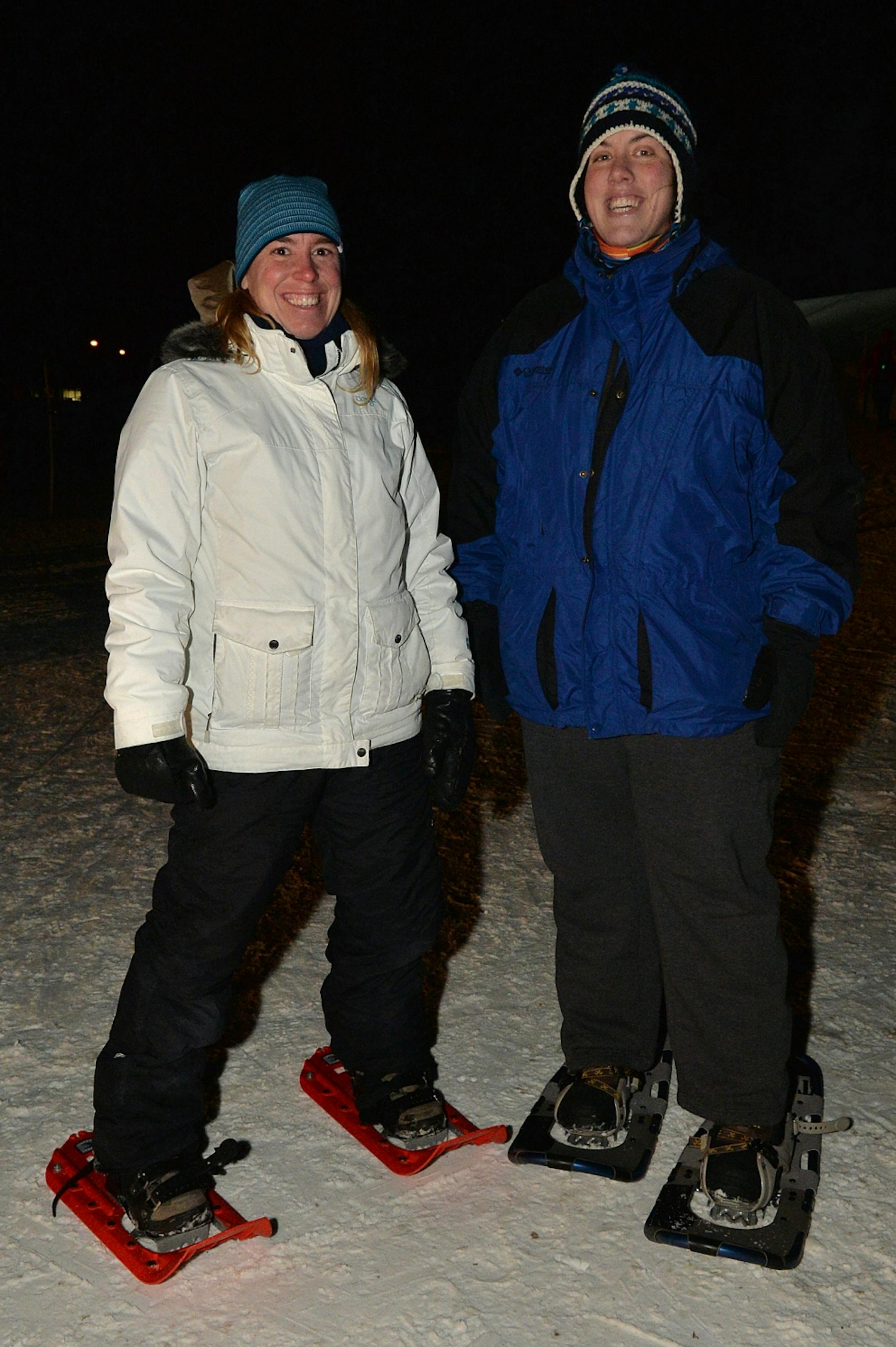 Mitzi Tetzloff (left) and Val Swanson suit up during their first visit to the Loppet luminary race.